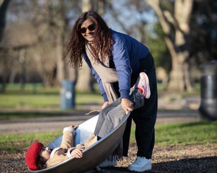 Naz B and daughter in a playground