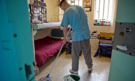 A prisoner mopping his cell in His Majesty’s Young Offender Institution Aylesbury, Buckinghamshire.