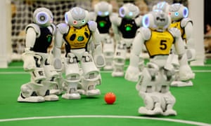The robotic equivalent of Ronaldo lines up a free kick at a RoboCup football competition.