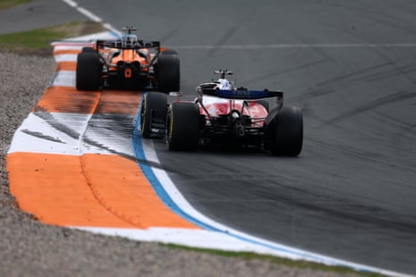 Oscar Piastri leads Charles Leclerc.