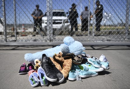 shoes near fence, with guards behind fence