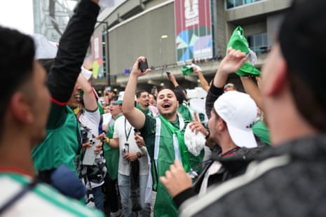 Fans build the atmosphere before heading into the stadium.