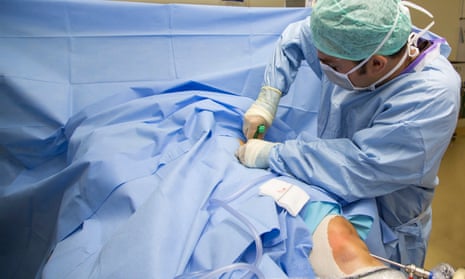 A surgeon undertakes pioneering knee surgery