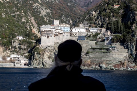 A monk looks toward Dionysiou from the ferry