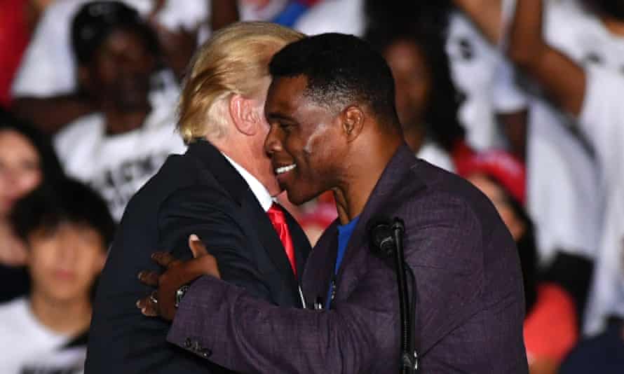 Walker and Trump embrace at a ‘Save America’ rally in Perry, Georgia, on 25 September 2021.