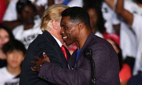 Herschel Walker greets Donald Trump in Perry, Georgia, in September.