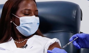 Nurse Sandra Lindsay receives the second dose of a Pfizer coronavirus disease vaccine, at Long Island Jewish Medical Center in the Queens borough of New York City.