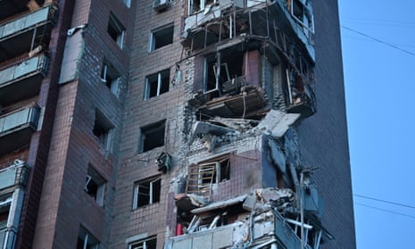 This photograph taken on April 4, 2024 shows a residential building damaged as a result of a missile attack in Kharkiv.