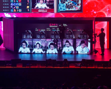 Team Hong Kong, Taiwan and Macau (C) play on stage in the League of Legends gaming tournament during the eSports and Music Festival in Hong Kong on August 4, 2017.Hundreds of youthful fans on August 4 cheered on video game players as they competed in a cyber battleground in Hong Kong’s first ever large scale eSports festival.