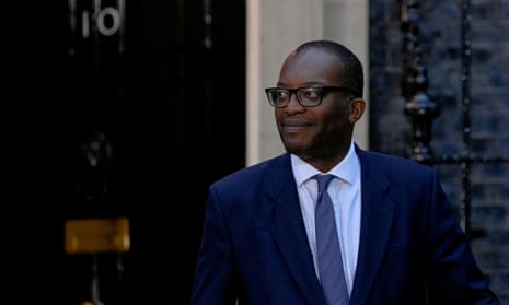 Chancellor of the Exchequer, Kwasi Kwarteng walks outside No 10.