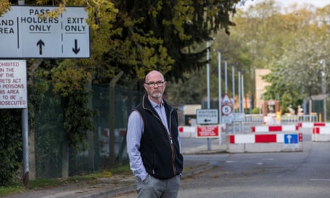 Marc Goddard, a parish councillor at Linton-on-Ouse, outside the entrance to the former RAF base