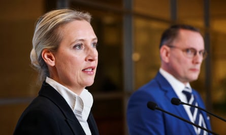 Co-leader of the Alternative for Germany party (AfD) Alice Weidel speaks as Tino Chrupalla listens after the German parliament voted against an opposition draft law on tightening immigration policy, in Berlin on 31 January.