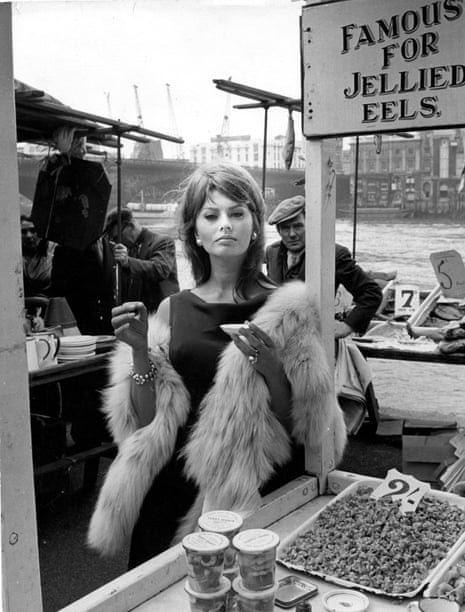 Sophia Loren enjoys the local cuisine while filming The Millionairess in
