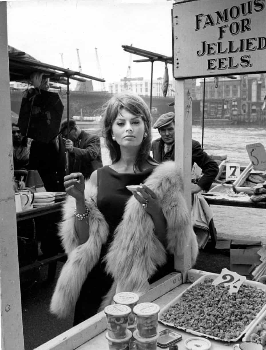 Sophia Loren enjoys the local cuisine while filming The Millionairess in