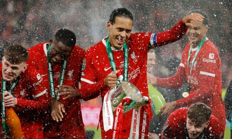 Virgil van Dijk shows off the trophy after Liverpool’s 1-0 victory (after extra time) over Chelsea