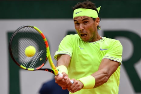 Rafael Nadal returns to break serve.