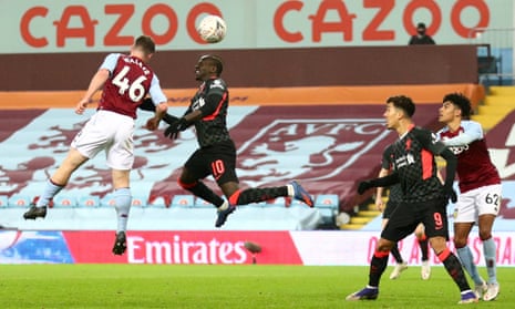 Sadio Mané leaps to score Liverpool’s third goal.