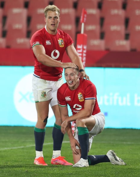 British and Irish Lions’ Josh Adams is congratulated by Duhan van der Merwe after scoring a try.