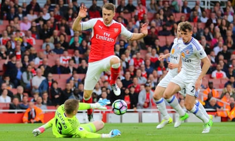 Sunderland Goalkeeper Jordan Pickford clears the ball as Aaron Ramsey of Arsenal moves in to challenge.