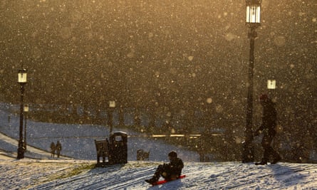 Sledding on the grounds of the Stormont estate in Belfast.