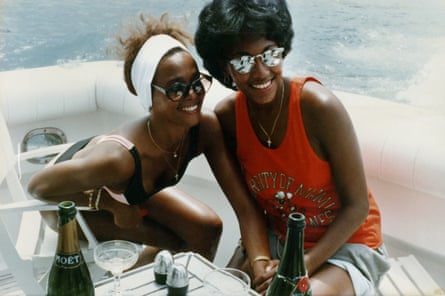 Whitney Houston and Robyn Crawford with bottle of champagne, on a boat, from the book A Song for You: My Life with Whitney Houston by Robyn Crawford