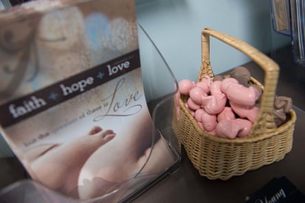 A table in one pregnancy center’s lobby holds brochures and a basket of plastic fetuses.