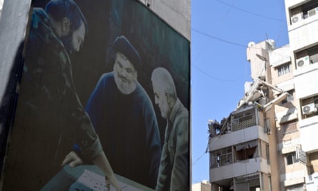 Mural of Imad Mughniyeh, Hassan Nasrallah and Qassem Soleimani next to a damaged building.