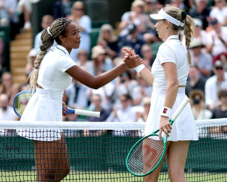 Katie Boulter clasps hands with Tyra Caterina Grant after losing against the qualifier in the first round of Wimbledon