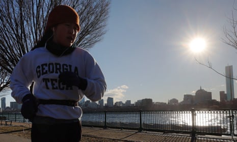 A jogger runs on a cold winter morning in Cambridge, Massachusetts.