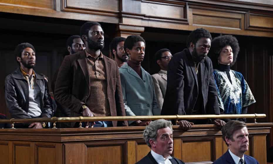 Front row of witness box, l to r, Darcus Howe (Malachi Kirby), Altheia Jones-LeCointe (Letitia Wright), Frank Crichlow (Shaun Parkes), Barbara Beese (Rochenda Sandall) in Steve McQueen’s Mangrove. 