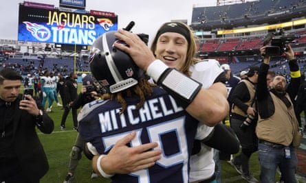 Trevor Lawrence hugs Tennessee Titans cornerback Terrance Mitchell after Sunday’s game