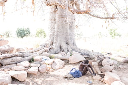 Baba Agunua has been chained to the root of a baobab tree in Zorko village for three years.