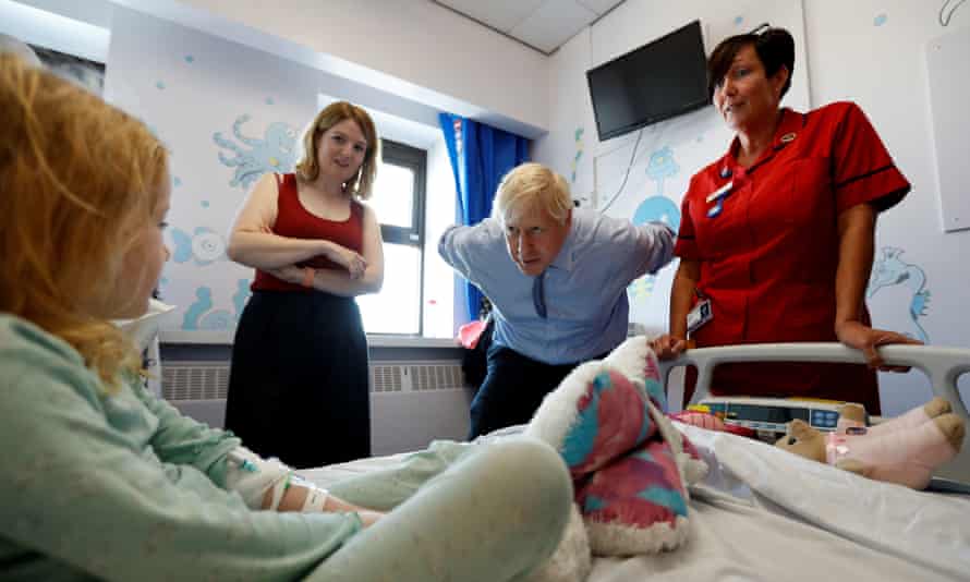 Boris Johnson talking to patient Scarlett Gibbons, 5, during his visit to the Royal Cornwall Hospital in Truro this morning.