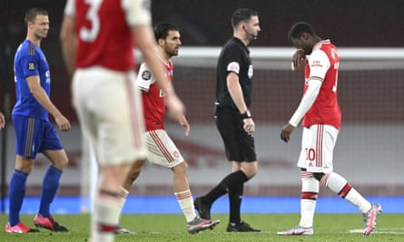 Arsenal’s Eddie Nketiah (right) walks off after he was given a red card for a challenge on the Leicester defender Justin James.