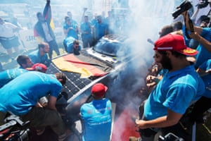 Team members of HS Bochum from Germany celebrate at the finish line of the World Solar Challenge in Adelaide.
