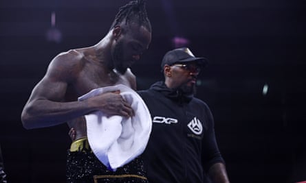 A demoralised Deontay Wilder leaves the ring
