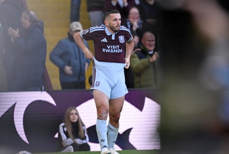 John McGinn pulls his shorts up.