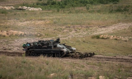 An armoured mine clearance vehicle moves towards enemy positions during a training exercise