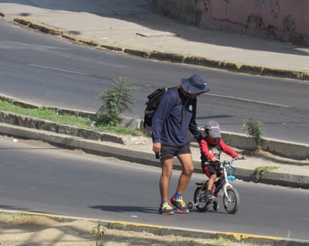 A man and a child enjoy the quiet streets.