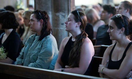 Mourners gather at St. Peters Church in Nottingham city centre for a vigil and to lay flowers and light candles for the people killed in the attack
