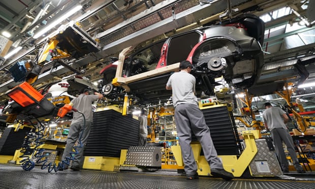 Workers on the production line at Nissan's factory in Sunderland.