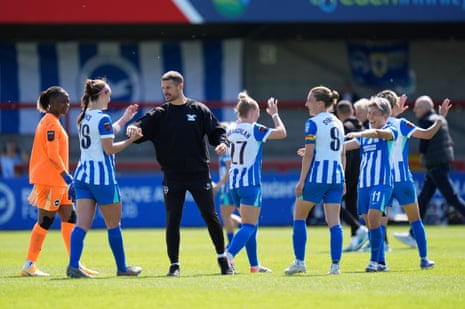 Dario Vidosic congratulates his victorious Brighton players after their win over league leaders Manchester City at the Broadfield Stadium in Crawley.