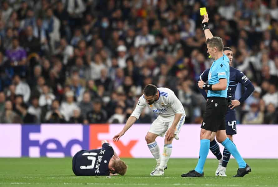 Real Madrid v Manchester City: Champions League semi-final, second leg – live! | Champions League 5 Daniel Carvajal of Real Madrid checks on Kevin De Bruyne as he is shown a yellow card by referee Daniele Orsato.