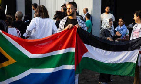 Protesters hold flags and placards at a demonstration organised by the South African Jews for a free Palestine group in Johannesburg.