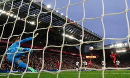 Mohamed Salah smashes in a penalty against Fulham at Anfield.