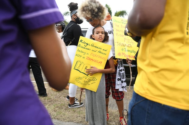 People calling for slavery reparations, protest outside the entrance of the British High Commission during the visit of the Duke and Duchess of Cambridge in Kingston, Jamaica on March 22, 2022