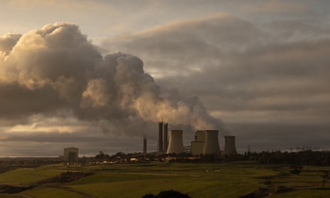 Chimneys of the Coal-fired power station Loy Yang bellowing steam into the air