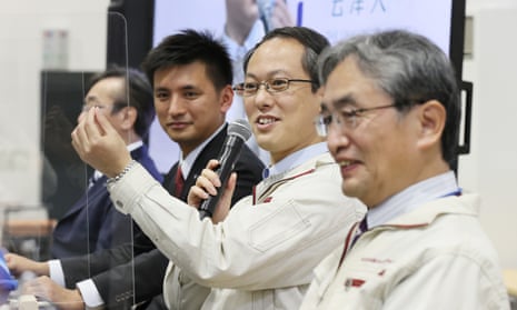Yuichi Tsuda (second right), Hayabusa-2 project manager of the Japan Aerospace Exploration Agency (JAXA), speaks during a press conference at  in Sagamihara, Kanagawa prefecture