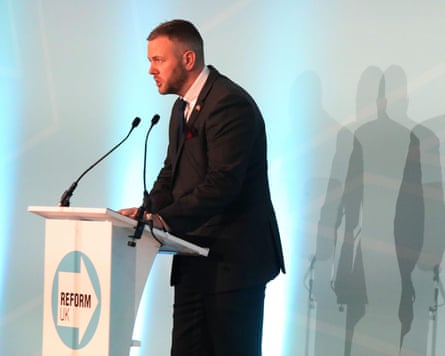 Robert Kenyon speaks at a Reform UK lectern