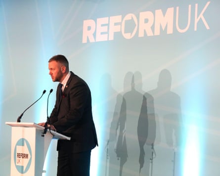 Robert Kenyon speaks at a podium